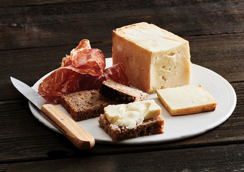 Limburger cheese and salami on plate