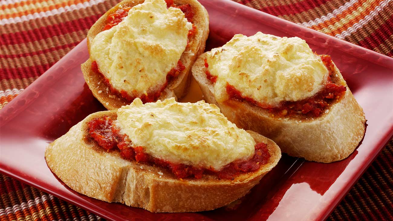 Fontina Baguette Toasts with Sun-Dried Tomatoes